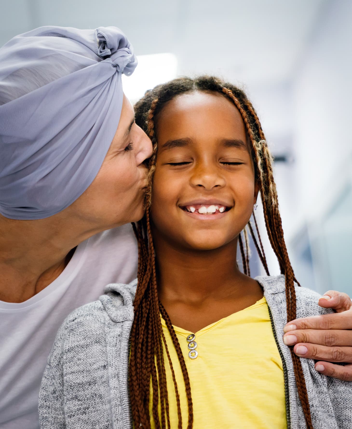 Woman Kisses Happy Girl With Braided Hair 2026 09 24 08 20 52 Utc 1